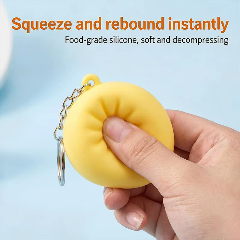 Porte-clés en silicone lumineux et adorable en forme de chignon, accessoire de dessin animé parfait pour le soulagement